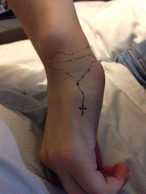 Rosary tattoo, Rosary foot tattoos, Wrist tattoos for guys