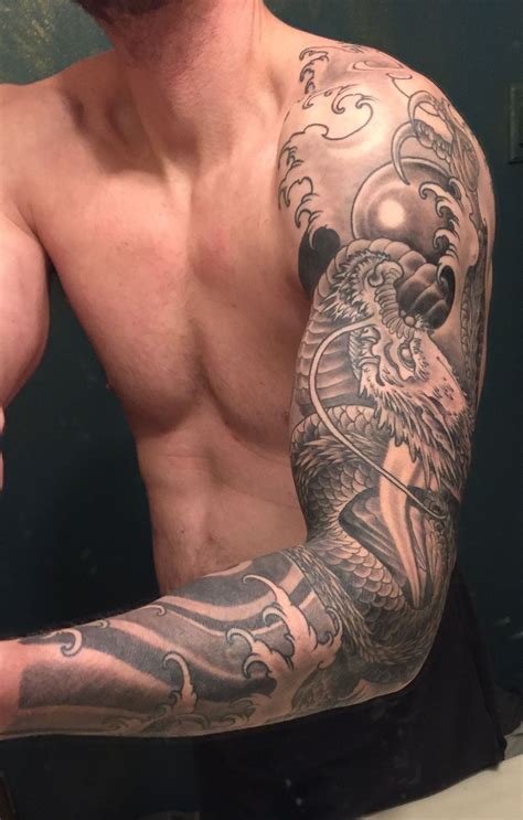 Black and Grey Dragon Sleeve Tattoo | Men tattoos arm sleeve, Dragon sleeve tattoos, Forearm ...
