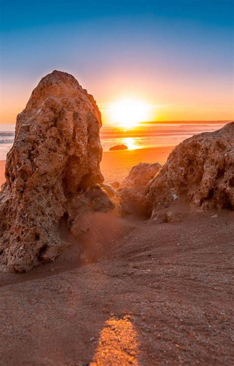 Download Beach Sunrise Rock Formation Scenery Wallpaper | Wallpapers.com