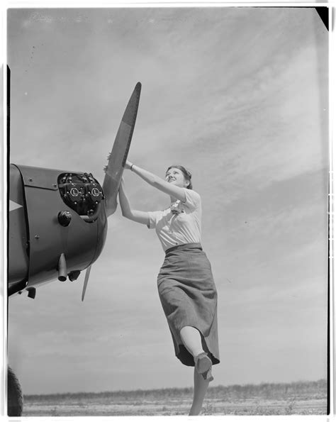 Unidentified Woman Starting a Plane - The Portal to Texas History