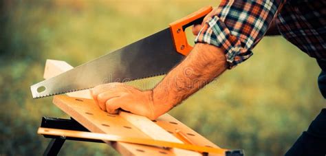 Carpenter Sawing a Wooden Square with a Wood Saw Stock Image - Image of ...