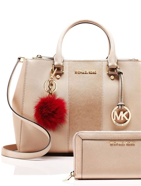 Mix and match a MICHAEL Michael Kors handbag, wallet and pom charm to ...