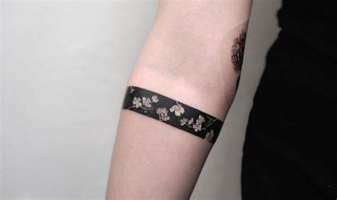 Floral black armband tattoo.