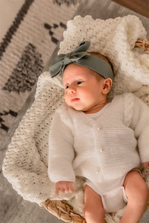 A Newborn Baby in a Basket · Free Stock Photo