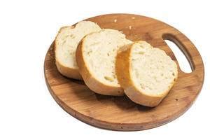 Loaf bread on wooden tray with small plant on side - Creative Commons Bilder