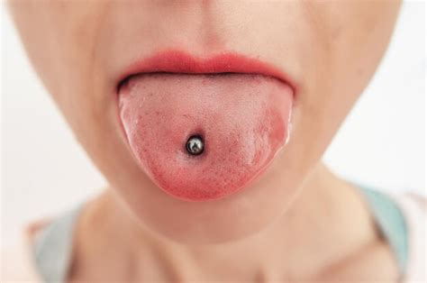 Premium Photo | Wwoman's tongue with a piercing cosmetology salon open ...