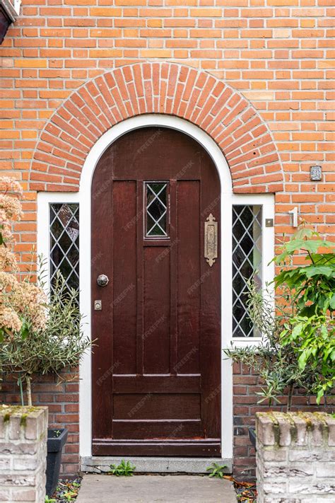 Premium Photo | Wooden front door of a home front view of a wooden ...