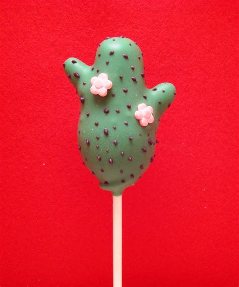 a close up of a green cake on a stick