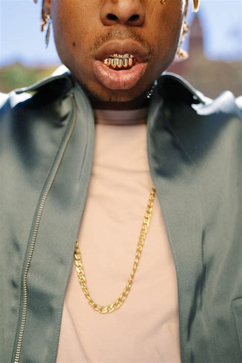 "Crop Black Rapper With Gold Teeth" by Stocksy Contributor "Javier Díez ...