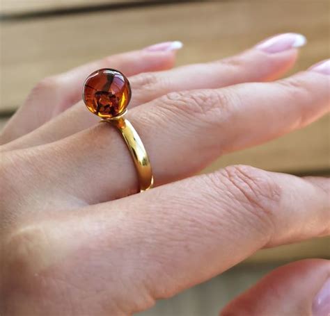 Adjustable Cognac Amber Ring in Gold Plated Sterling Silver.