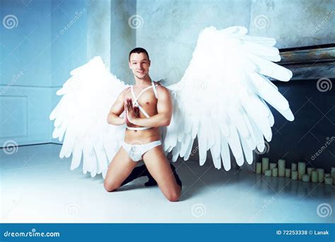 Man with angel wings stock photo. Image of cheerful, brutality - 72253338