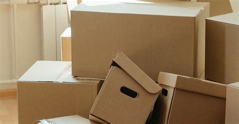 Brown Cardboard Boxes on White Floor · Free Stock Photo