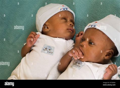 Baby twins black hi-res stock photography and images - Alamy