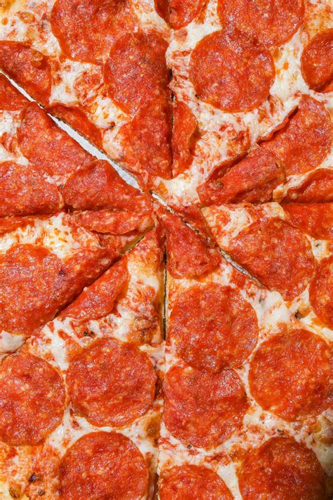 Sliced Pepperoni Pizza In Close-up View · Free Stock Photo