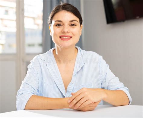 Woman Sitting at Table in Living Room Stock Photo - Image of stylish, graceful: 231464826
