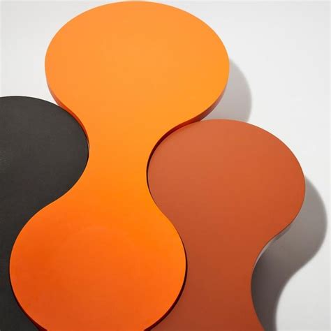 two orange and black circles on a white surface