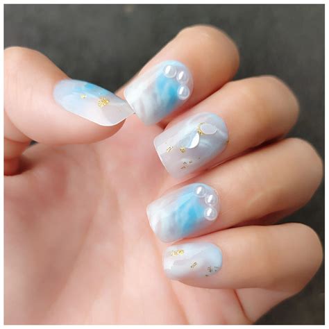 Get Glamorous with Blue Glittery Acrylic Nails - Sparkle like a Star!