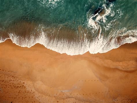Premium Photo | Beach on aerial drone top view with ocean waves ...