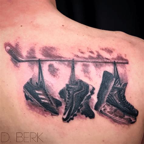 Aggregate 70+ crossed hockey stick tattoos latest - in.cdgdbentre