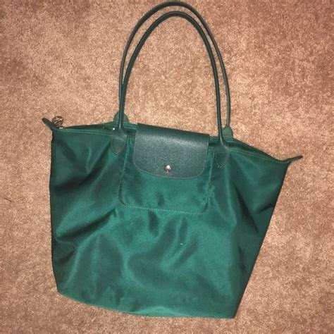 Large Longchamp Neo tote in emerald green with silver hardware. Gently used with a minor scuff ...