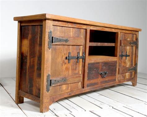 an old wooden cabinet with metal handles and latches on the doors is ...