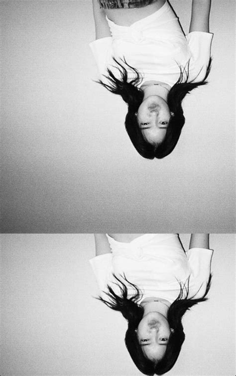 two pictures of a woman upside down in the air with her hair flying through the air