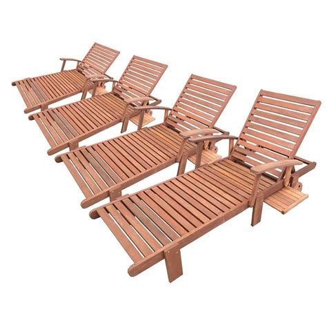 six wooden lawn chairs sitting next to each other