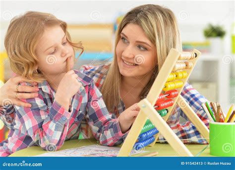 Mother and Daughter Study at the Table Stock Image - Image of love, women: 91542413