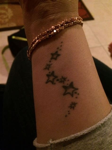 Reach for the stars | Feminine tattoos, Elegant tattoos, Star tattoos