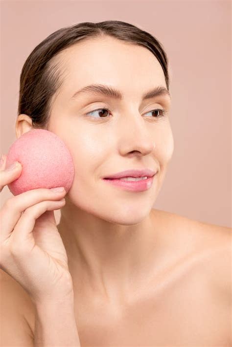 Woman Holding Pink Round Sponge · Free Stock Photo