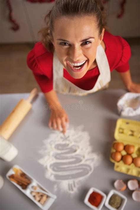Housewife Drawing Christmas Tree on Kitchen Table with Flour Stock Photo - Image of draw ...