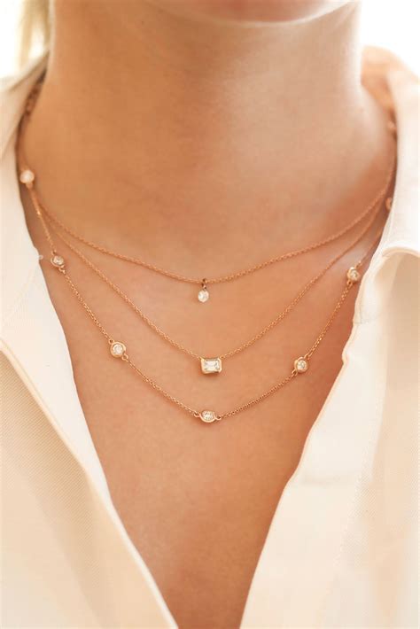 Layering necklaces creates the perfect dynamic look to pair with a ...