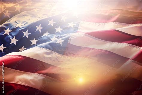 USA flag. American flag. American flag blowing wind at sunset or sunrise. Stock Photo | Adobe Stock