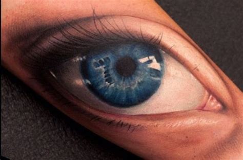 Realistic blue eye tattoo on arm - Tattooimages.biz