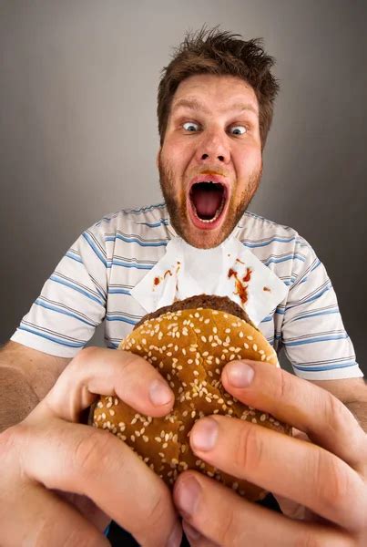 Fat man eating burger — Stock Photo © Nomadsoul1 #5590497