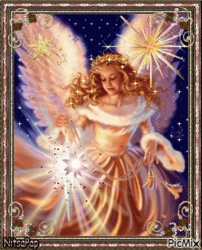 an angel holding a star in her hands with the light shining through it ...