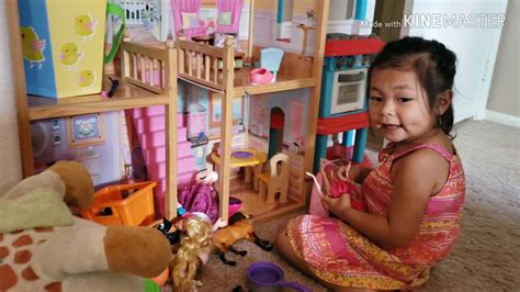 Sofia playing on her dollhouse. - YouTube