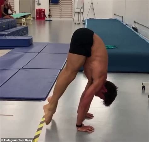 Tom Daley shows off his handstand talents as he perfects gymnastic ...