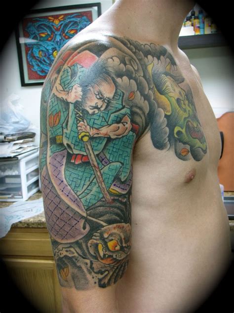 samurai killing a evil spider tattoo by Kike Castillo: TattooNOW