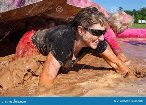 Women Run And Splash Through Mud Pit Editorial Photo | CartoonDealer ...