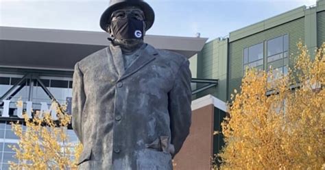 Curly Lambeau and Vince Lombardi statues get face masks