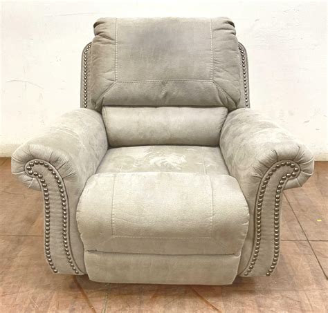 Lot - Ashley Furniture Traditional Faux Leather Recliner