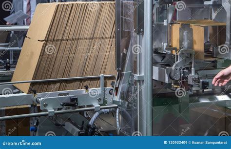 Automatic carton erector stock image. Image of manufacturing - 120933409