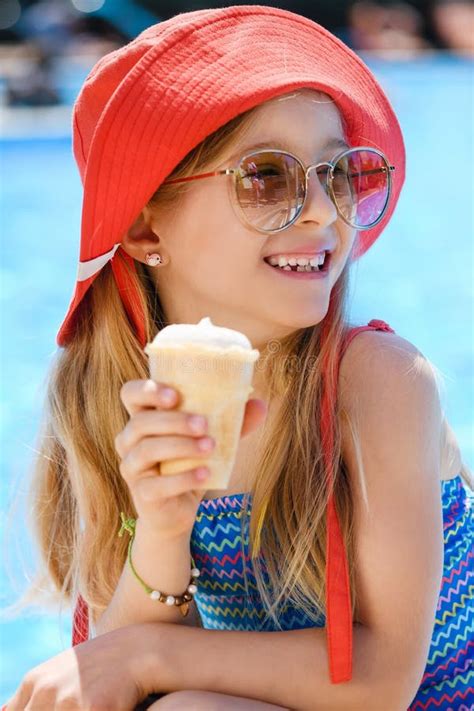 Happy Girl with Ice Cream in Pool Stock Photo - Image of little, eating: 257432378