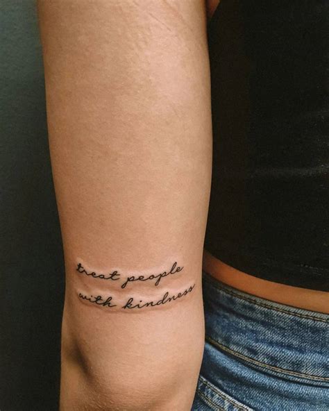 Tattoo that says "treat people with kindness" located