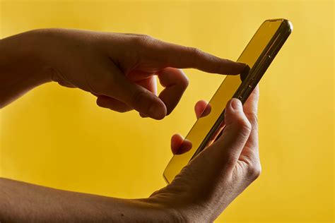 Tablet with a blank screen, yellow headphones and notepad on yellow background - Creative ...