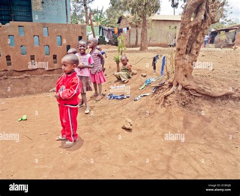 African school children playing in yard outside Africa;Children of ...