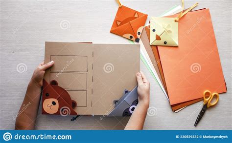 Girl Holding a Book with Crafted Paper Bookmark Stock Photo - Image of ...