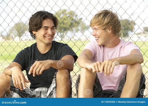 Boys Sitting On A Hay Bale Stock Photography | CartoonDealer.com #59817368