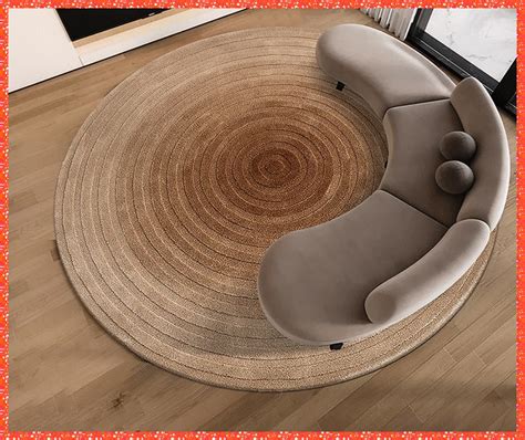 a living room with a round rug on the floor